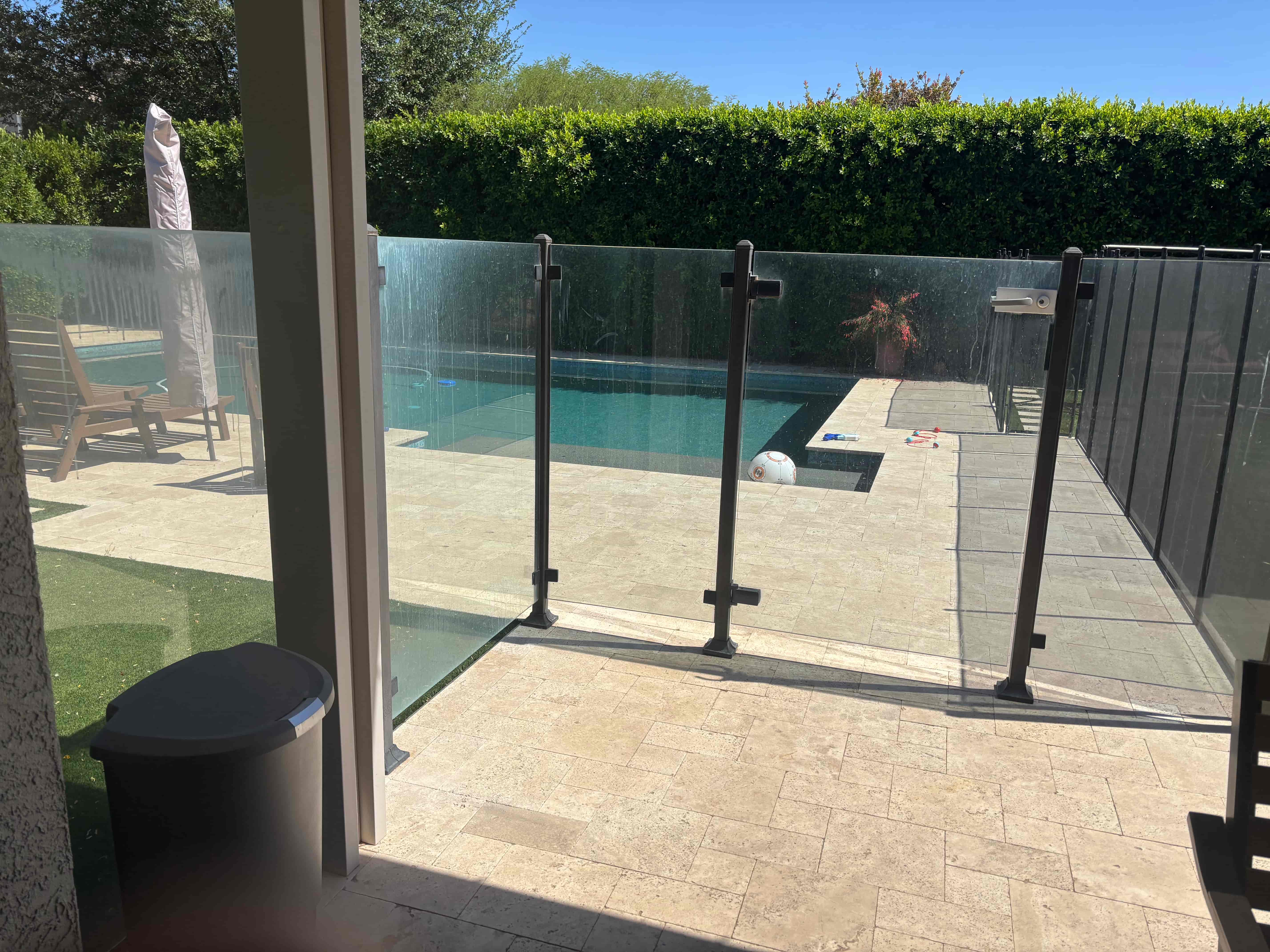 Pool gate glass hard water buildup before cleaning