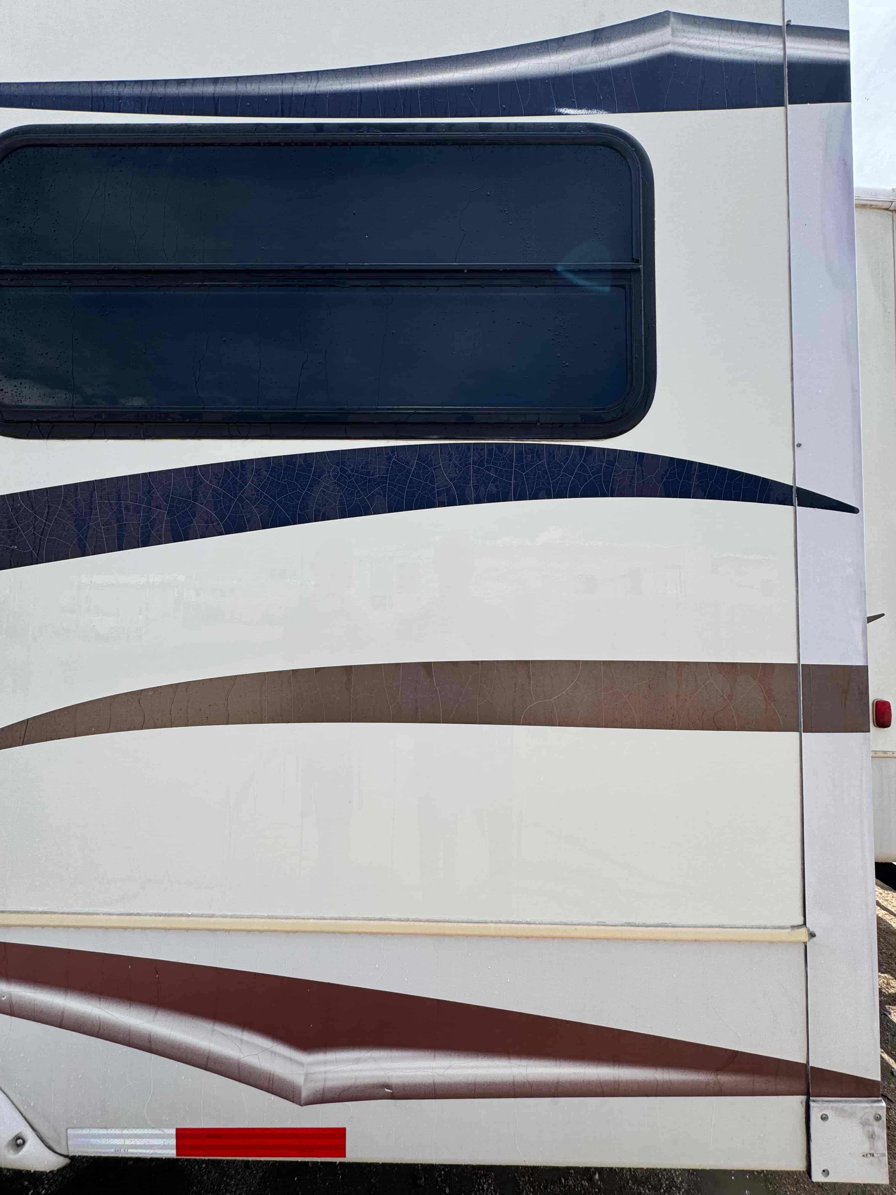 RV side close-up after exterior wash