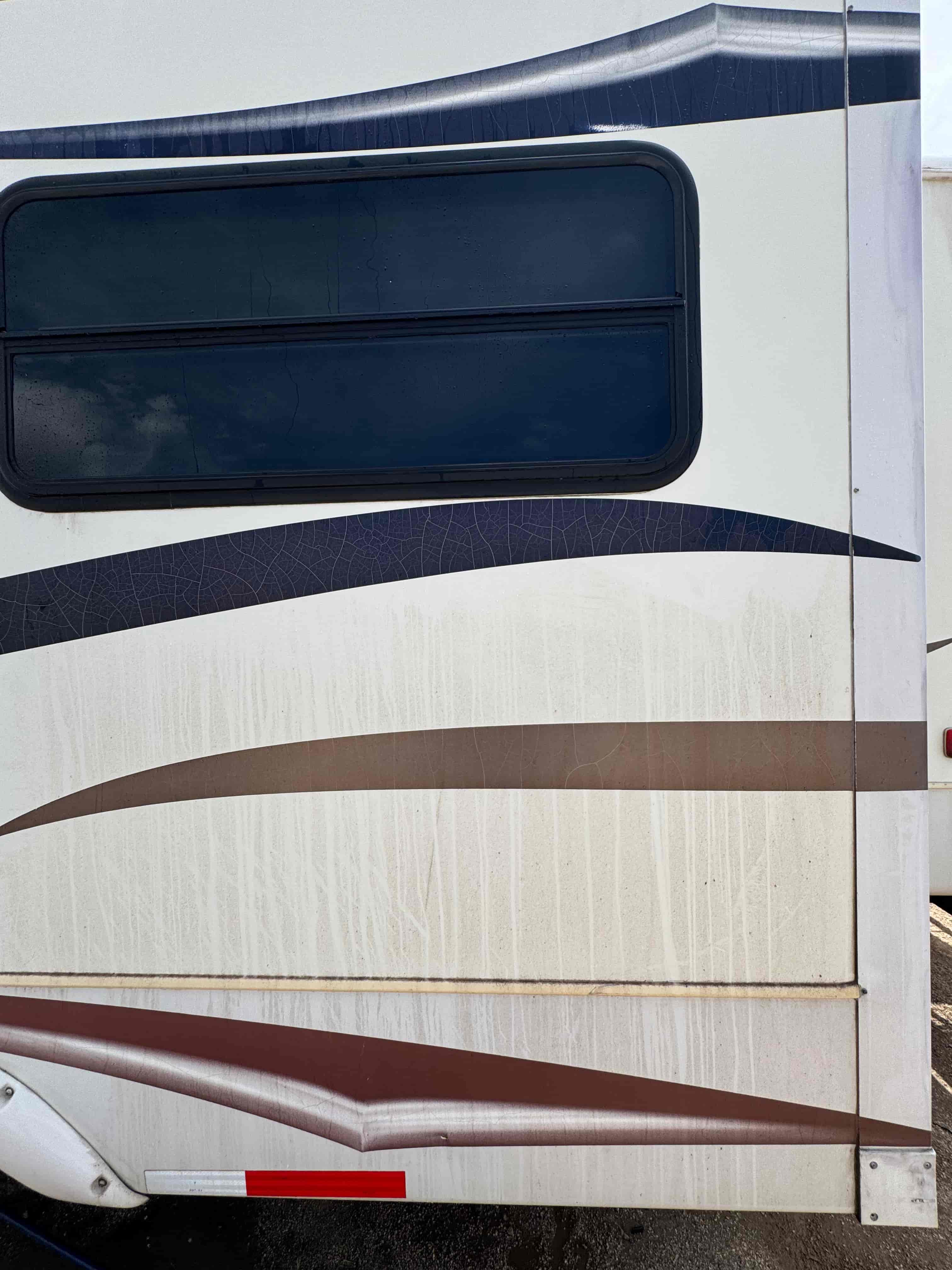 RV side close-up before exterior wash