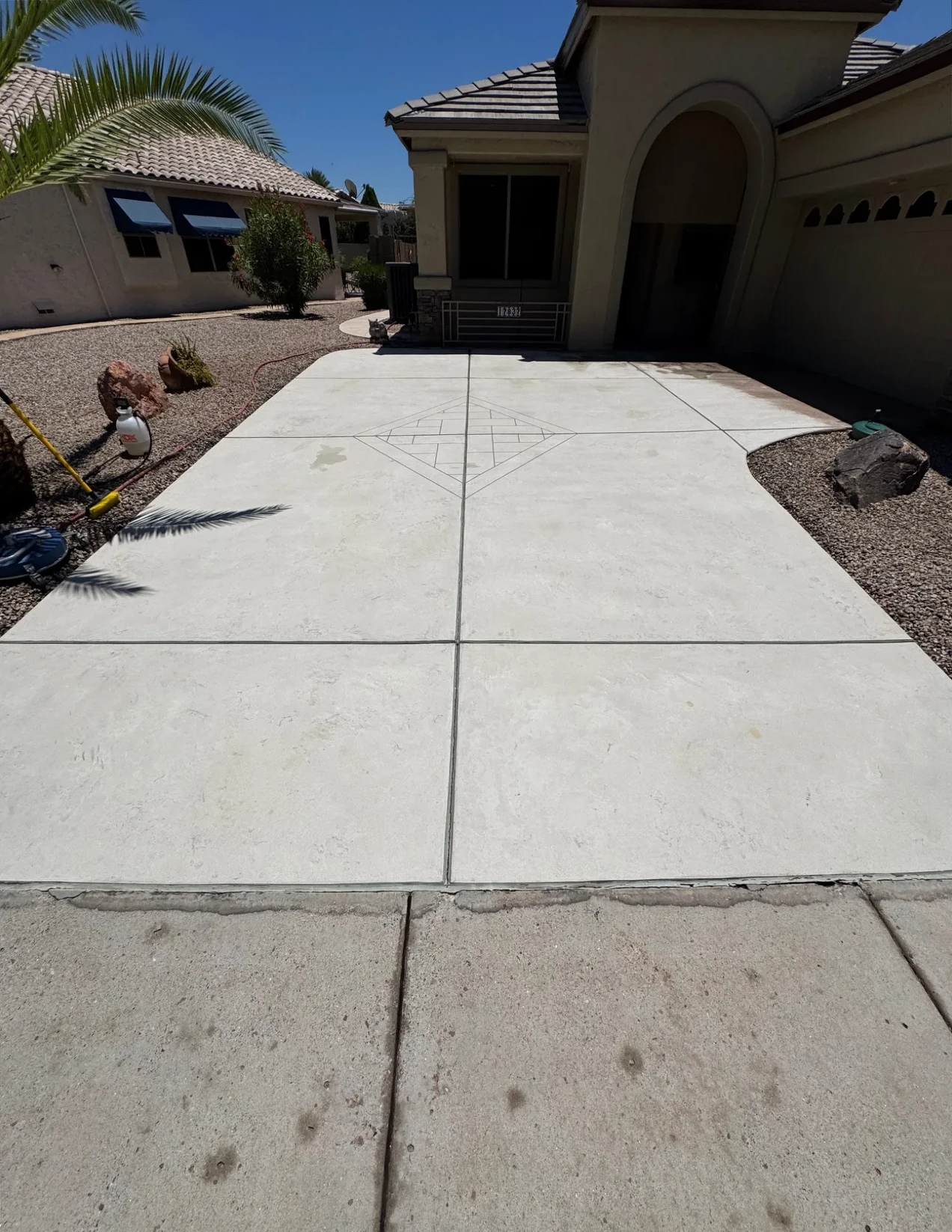 Clean residential driveway after pressure washing