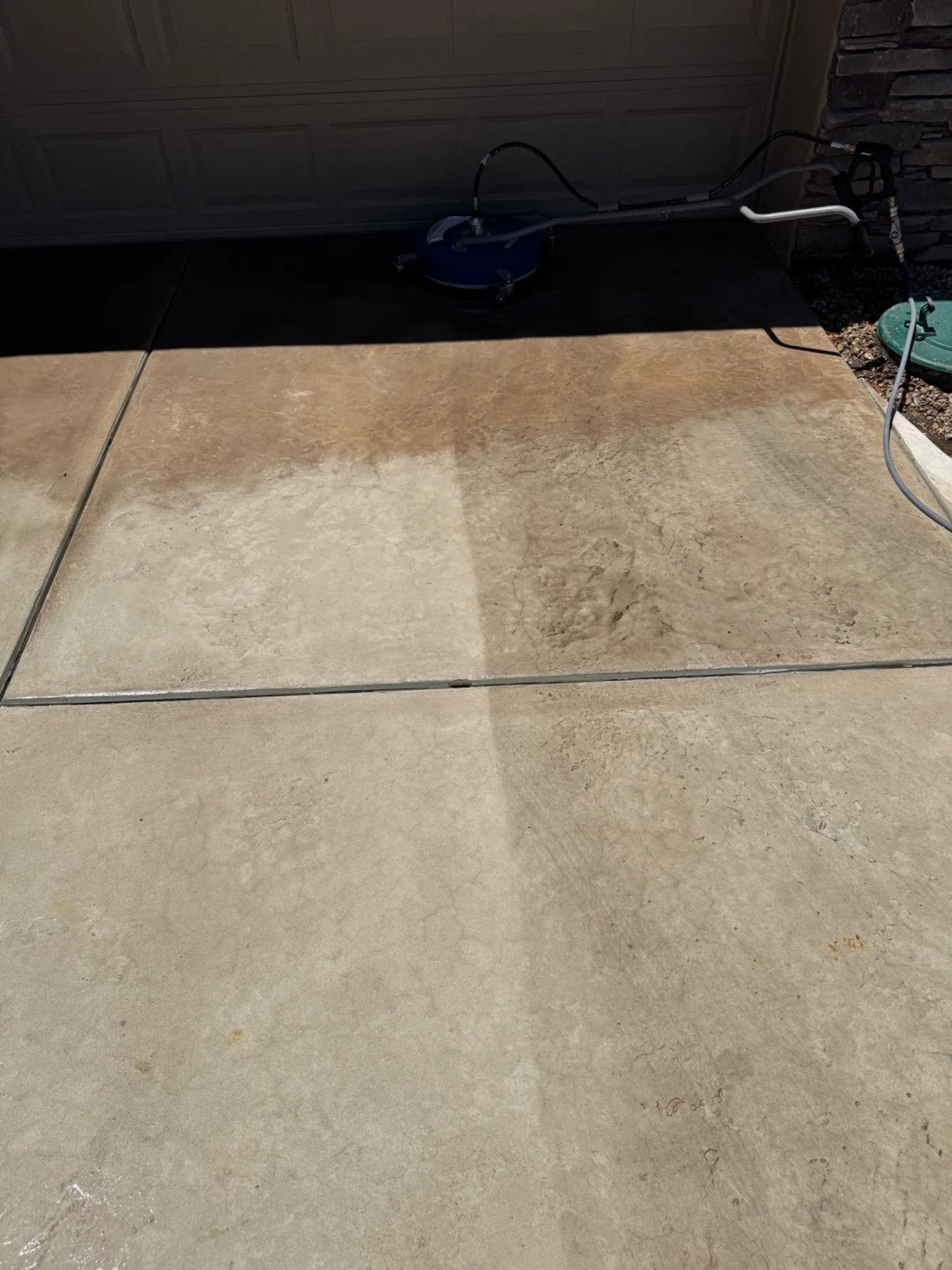 Surface cleaner working across a residential driveway