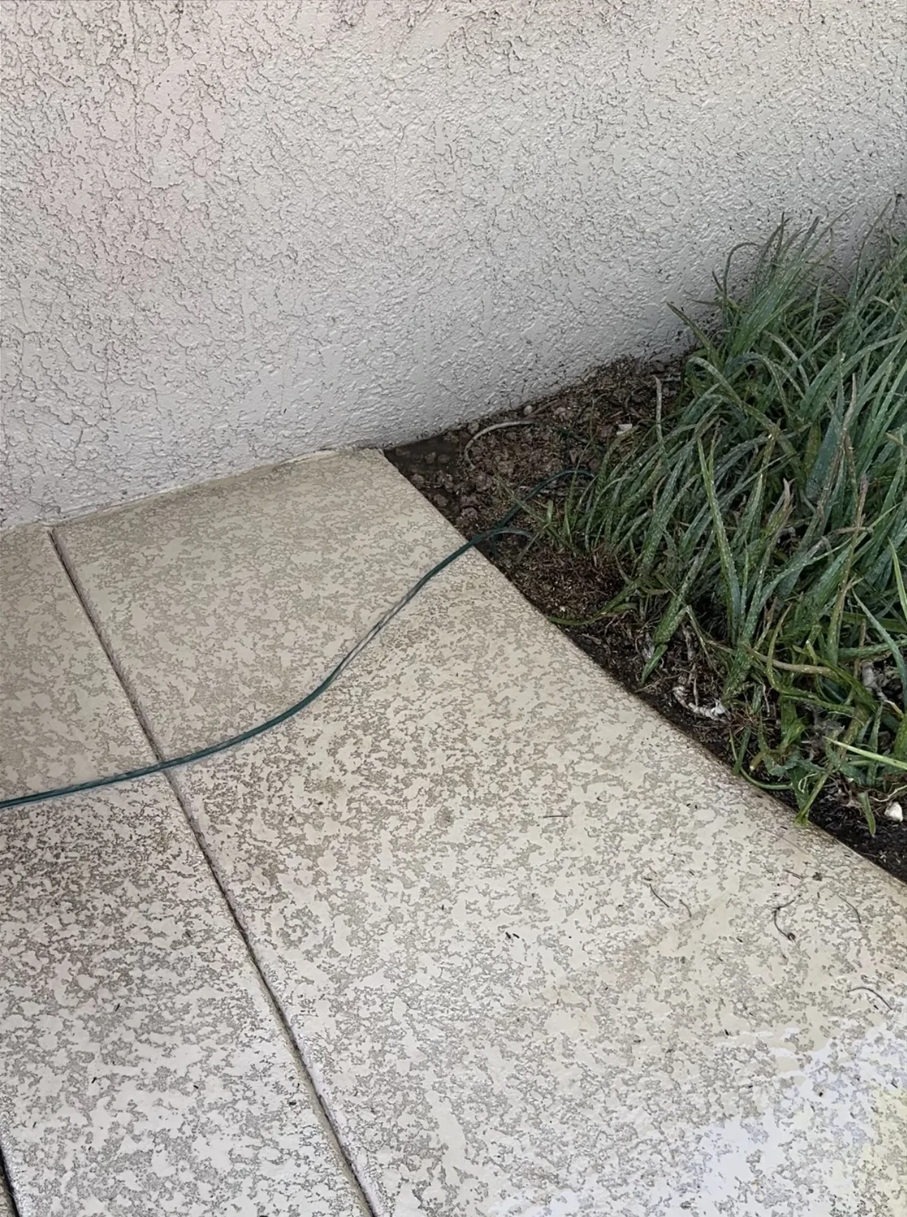 Patio area beneath a grill after cleaning