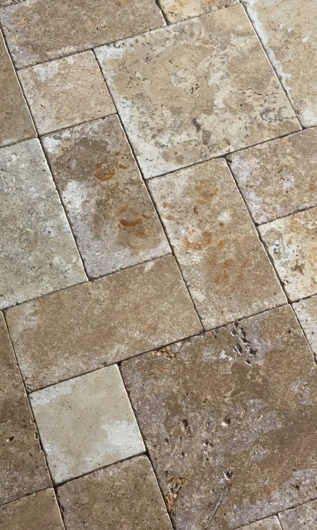 Rust staining on travertine before treatment